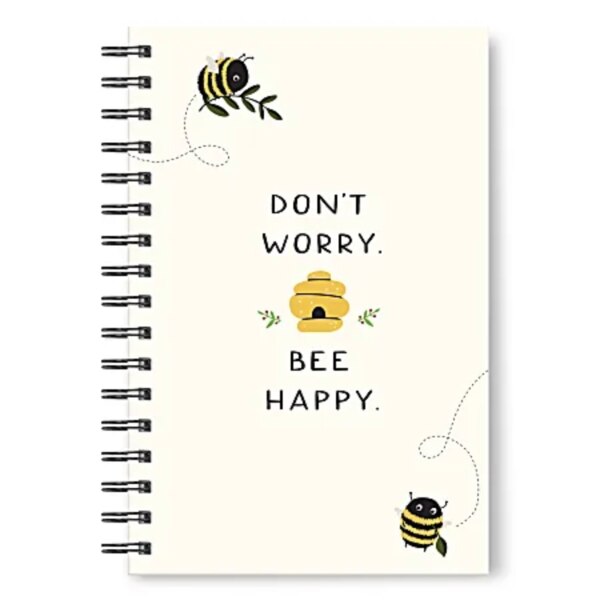 front of notebook, light yellow with "Don't Worry Bee Happy" in the middle and two bees and a beehive